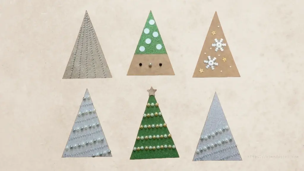 6枚のツリー型カード。パール調シールや雪の結晶、星などで装飾されている。