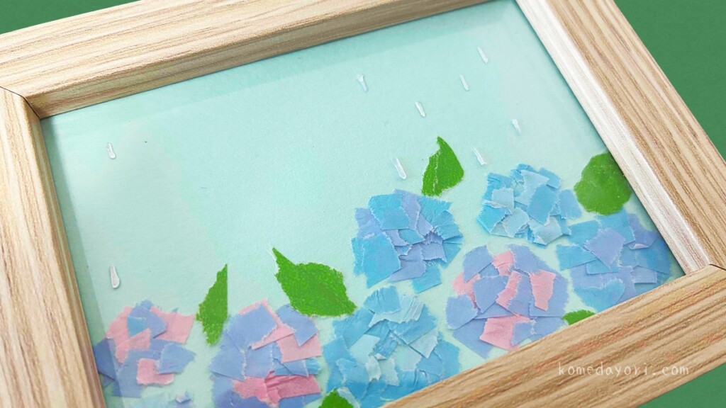 写真立てのプラ板に白のマジックで雨のしずくを描き足した様子